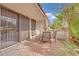 Outdoor patio with brick floors, table, umbrella and chairs at 2541 La Cara Ave, Las Vegas, NV 89121