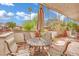 Relaxing patio with table, umbrella and outdoor seating at 2541 La Cara Ave, Las Vegas, NV 89121