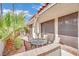 Outdoor patio featuring a table with an umbrella with chairs at 2541 La Cara Ave, Las Vegas, NV 89121