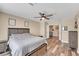 Bedroom with wood-look flooring, ceiling fan, and ensuite at 2737 Sunrise Day Ct, Las Vegas, NV 89142