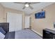 Bedroom with wall mounted TV, closet, bed, and ceiling fan at 2737 Sunrise Day Ct, Las Vegas, NV 89142