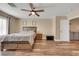 Bedroom features wood-look flooring and ceiling fan at 2737 Sunrise Day Ct, Las Vegas, NV 89142