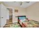 Bedroom with hardwood floors, ceiling fan, and neutral colored walls at 2737 Sunrise Day Ct, Las Vegas, NV 89142