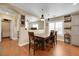 Dining area with wood table and chairs in an open concept home at 2737 Sunrise Day Ct, Las Vegas, NV 89142