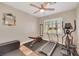 Dedicated exercise room with a treadmill, elliptical machine, weight bench, and ample space for workouts at 2737 Sunrise Day Ct, Las Vegas, NV 89142