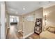 Hallway area featuring wood-look flooring and stairs with adjoining chair at 2737 Sunrise Day Ct, Las Vegas, NV 89142