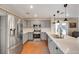 Contemporary kitchen with stainless steel refrigerator and gray cabinetry at 2737 Sunrise Day Ct, Las Vegas, NV 89142