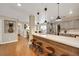 Stylish kitchen with a breakfast bar, modern pendant lighting, stainless steel appliances, and elegant countertops at 2737 Sunrise Day Ct, Las Vegas, NV 89142