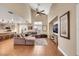 Inviting living area featuring hardwood floors, high ceilings, and a connected kitchen at 2737 Sunrise Day Ct, Las Vegas, NV 89142