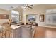 Inviting living room features a high ceiling, a ceiling fan and a large screen TV at 2737 Sunrise Day Ct, Las Vegas, NV 89142