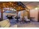 Outdoor kitchen and dining area with a covered pergola and string lights at 2737 Sunrise Day Ct, Las Vegas, NV 89142