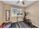 Workout room with treadmill, elliptical, ceiling fan, and plenty of natural light at 2737 Sunrise Day Ct, Las Vegas, NV 89142