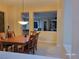 Comfortable dining area with wood table and chairs, adjacent to other living spaces at 2764 Leys Burnett Ave, Henderson, NV 89044