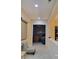 Hallway with tiled floors and neutral paint leading into another room at 2764 Leys Burnett Ave, Henderson, NV 89044