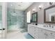 Modern bathroom with glass shower, dual sinks, and elegant finishes at 2987 Matese Dr, Henderson, NV 89052