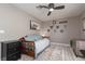 Bedroom features a daybed with decorative pillows, a ceiling fan, and a dresser at 2987 Matese Dr, Henderson, NV 89052