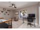 Bedroom setup with a twin bed, a ceiling fan, a desk, and a window at 2987 Matese Dr, Henderson, NV 89052