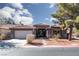 Charming single-story home featuring a tile roof, desert landscaping, and a two-car garage at 2987 Matese Dr, Henderson, NV 89052