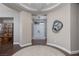 Elegant foyer featuring a decorative ceiling, arched doorway, and wood-look flooring at 2987 Matese Dr, Henderson, NV 89052