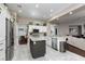 Well-lit kitchen with stainless steel appliances, granite counters, and an island at 2987 Matese Dr, Henderson, NV 89052