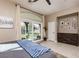 Main bedroom with sliding glass door to patio and view of backyard at 2987 Matese Dr, Henderson, NV 89052