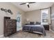 Comfortable main bedroom with dresser and ceiling fan at 2987 Matese Dr, Henderson, NV 89052