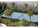 Scenic view of the well-maintained tennis court surrounded by lush landscaping and palm trees at 322 Karen Ave # 1101, Las Vegas, NV 89109