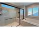 Bathroom with shower, bathtub and modern fixtures at 3498 Monte Cervino Ave, Henderson, NV 89044