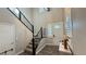 Bright entryway with staircase, wood-look floors, and natural light at 3498 Monte Cervino Ave, Henderson, NV 89044