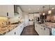 Spacious kitchen with granite counters, white cabinets, and stainless steel appliances at 3498 Monte Cervino Ave, Henderson, NV 89044