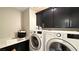 Laundry room with LG washer and dryer, and plenty of cabinet space at 3498 Monte Cervino Ave, Henderson, NV 89044