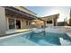 Luxury pool and spa with a covered patio and outdoor kitchen at 3498 Monte Cervino Ave, Henderson, NV 89044