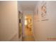 Clean and bright hallway with artwork and mirror at 3561 Arville St # 801B, Las Vegas, NV 89103