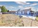 Backyard view showcasing the pool, covered patio area and grassy area at 3826 S Torrey Pines Dr, Las Vegas, NV 89103