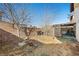 Small backyard with lattice fence and small trees at 3883 Steinbeck Dr, Las Vegas, NV 89115