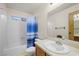 Bathroom with a shower/tub combo and wood vanity at 3883 Steinbeck Dr, Las Vegas, NV 89115