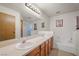 Bathroom with double sinks and a separate bathtub at 3883 Steinbeck Dr, Las Vegas, NV 89115