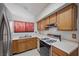 Kitchen features stainless steel appliances and wood cabinets at 3883 Steinbeck Dr, Las Vegas, NV 89115