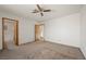 Large main bedroom with ceiling fan and en-suite bathroom access at 3883 Steinbeck Dr, Las Vegas, NV 89115