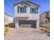 Beautiful front view of a well-maintained two-story home with neutral siding and manicured landscape at 4550 Kali Lyn St, North Las Vegas, NV 89031