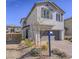 This home features desert landscaping and a two-car garage, complemented by sleek exterior shutters at 4550 Kali Lyn St, North Las Vegas, NV 89031