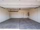 Spacious two car garage with concrete flooring and overhead storage rack at 4550 Kali Lyn St, North Las Vegas, NV 89031