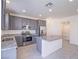 Well-lit kitchen boasts stainless steel appliances and a functional island at 4550 Kali Lyn St, North Las Vegas, NV 89031