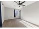 Spacious bedroom with ceiling fan and neutral carpeting at 465 Federal St, Henderson, NV 89015