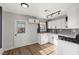 Modern kitchen with white cabinets, gray backsplash and new appliances at 465 Federal St, Henderson, NV 89015