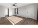 Living room with hardwood floors, ceiling fan and an entryway at 465 Federal St, Henderson, NV 89015