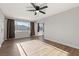 Living room with hardwood floors, window, and ceiling fan at 465 Federal St, Henderson, NV 89015