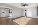 Bright living room with light hardwood floors and ceiling fan at 465 Federal St, Henderson, NV 89015