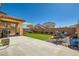 Outdoor living space with artificial turf, seating area, and desert landscaping at 5329 Fireside Ranch Ave, Las Vegas, NV 89131