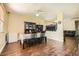 Bright dining area featuring wood floors, dining table, and natural light at 5329 Fireside Ranch Ave, Las Vegas, NV 89131